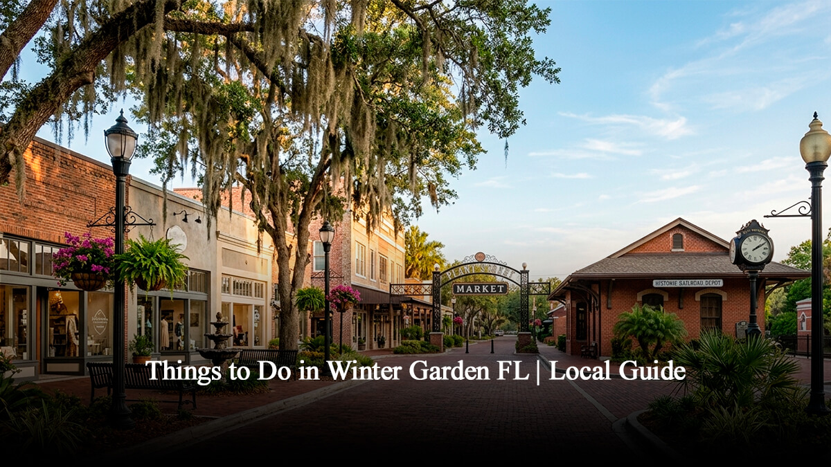 Historic Downtown Winter Garden brick street view featuring Plant Street Market entrance signs, old railroad depot museum, and majestic oak trees with Spanish moss in Central Florida.