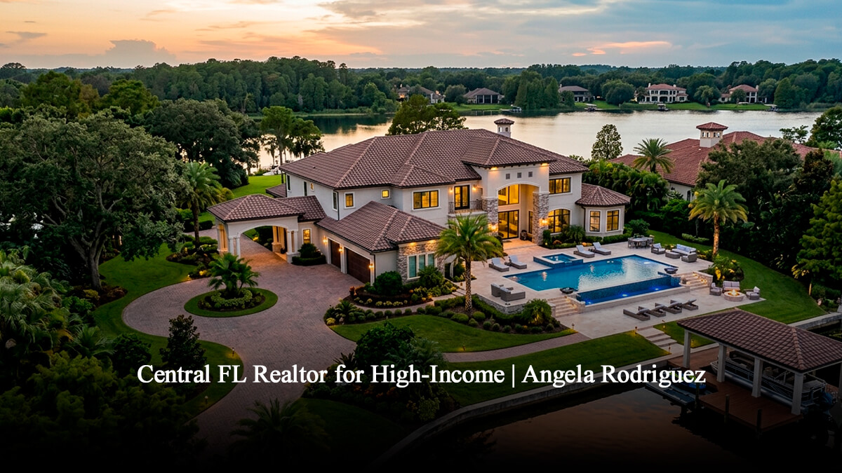Aerial view of a luxury waterfront estate in Windermere, Central Florida, featuring a custom swimming pool, private boat dock, and Mediterranean architecture at sunset.